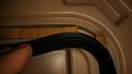 Here you can see strips of cardboard placed placed in the gasket groove fixing the issue.